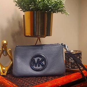 Michael Kors wristlet in Magenta or grey. 20.00 each.